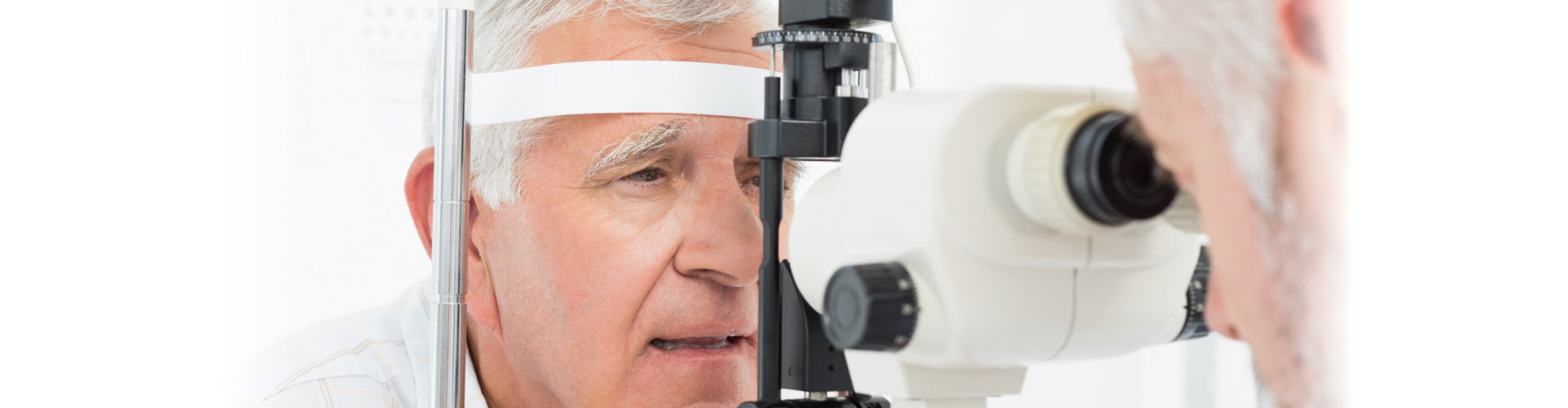 an optometrist doing sight testing for senior patient